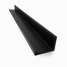 an angled black plastic shelf on a white background