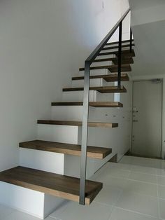 the stairs are made of wood and metal