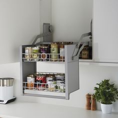 the kitchen is clean and ready to be used as a storage unit for canned food