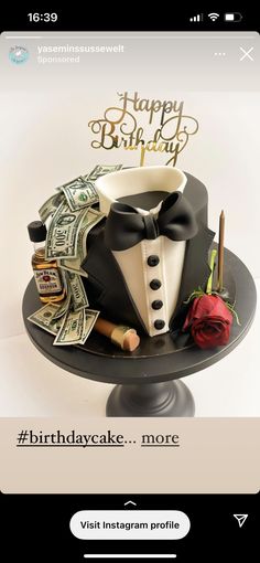 a birthday cake with money on top and a tuxedo wearing a bow tie