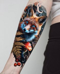 a woman's arm with a fox and mushrooms tattoo design on the left forearm