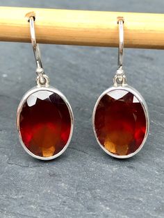 Garnet Earrings Faceted Oval,Hessonite Large Blood Red Garnet Natural,Top Quality Jewelry,Bright Fire Red Gemstone Earrings Sterling Silver Garnet Earrings Faceted Oval Shape, these Hessonite Large Blood Red Garnet Natural Gems is Top Quality Jewelry and Bright Fire Red Gemstone Earrings Sterling Silver 925. This is beautiful red Garnet at its finest. These Faceted Hessonite Garnets literally glow and flash fiery red, and are 100% Natural Garnet.  This most gorgeous and rare Hessonite Garnet Ear Red Round Earrings With Polished Finish, Red Polished Earrings For Gift, Red Oval Ruby Earrings, Red Faceted Earrings For Anniversary, Oval Red Ruby Earrings, Hallmarked Oval Red Earrings, Red Oval Gemstone Earrings, Faceted Oval Red Jewelry, Red Oval Faceted Jewelry