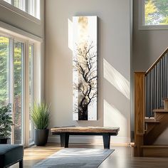 a living room filled with furniture and a painting on the wall above a coffee table