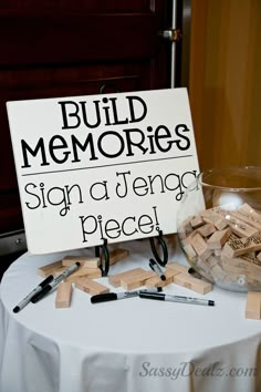 a sign that says build memories on top of a table with scissors and other items