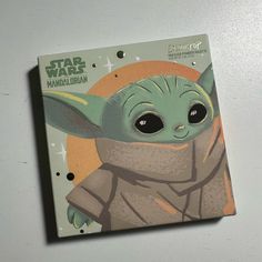 a close up of a book with an image of a baby yoda