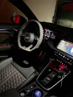 the interior of an audi car is shown in this undated image, with electronic controls and touchscreens