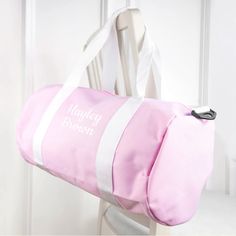 This stylish canvas bag that doubles as a gym kit bag or a handy carry-on for the little ones, has a roomy main compartment in which their football kits and shoes can be stored into. There's a small outside pocket that can store keys to lockers, their phones or pocket change.

The white shoulder strap that stretches from 70 cm to 120 cm, and is 4 cm wide, can help the bag alternate between being hand-held and slung over their shoulder, while ensuring that it's never too heavy to carry.

Personalise it with their name and surname to make it their very own - and potentially, to stop some friendly sibling rivalry too! Three Characters, Cream Bag, Pink Gym, Gym Kit, Kids Gym, Cream Bags, Sports Bags Gym, Barrel Bag, Kit Bag