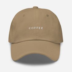 "Mornings are rough; slap on this hat and grab your coffee to start the day. The perfect hat for the COFFEE lover. This one's got a low profile with an adjustable strap and curved visor. * 100% chino cotton twill * Green Camo color is 35% chino cotton twill, 65% polyester * Unstructured, 6-panel, low-profile * 6 embroidered eyelets * 3 ⅛\" (7.6 cm) crown * Adjustable strap with antique buckle * Head circumference: 20 ½″-21 ⅝″ (50.8 cm-53.3 cm) * Blank product sourced from Vietnam or Bangladesh * Gifts For New Mothers, Mom Hats, Cute Coffee, Camo Colors, Negroni, Dad Caps, Embroidered Hats, Green Camo, Dad Hat