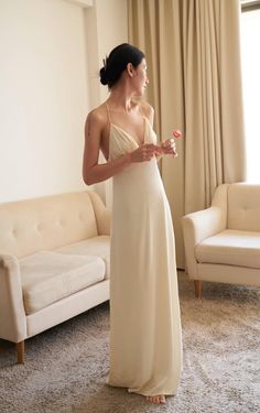 This maxi dress is made of satin and features a v neckline, thin, adjustable, crossed shoulder straps on the back, a side zipper closure, a flowy fit and a light, soft, shiny material. This maxi dress comes in light beige.
Also available for made-to-order (MTO) in other colors and sizes. Please send us an inquiry. Beige Flowy Dress, Loose Prom Dress, Silk Flowy Dress, Flowy Satin Dress, Bridal Fits, Flowy Silk Dress, Maxi Silk Dress, Cream Linen Dress, Womens Lounge