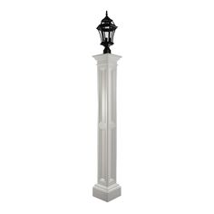 a tall white pillar with a black top and light on it's side, in front of a white background