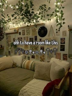 a living room with lots of plants hanging from the ceiling and lights on the walls