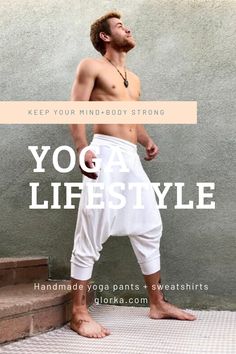 a man standing in front of a wall with the words yoga life style on it