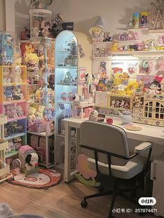 a room filled with lots of toys and stuffed animals on the wall next to a desk