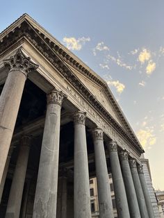 an old building with many columns and pillars