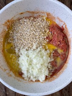 the ingredients in this bowl are mixed together to make a tasty looking dish with meat and rice