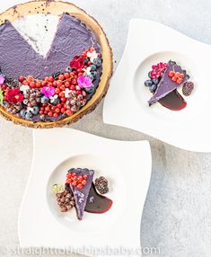 two desserts on plates with berries and other toppings