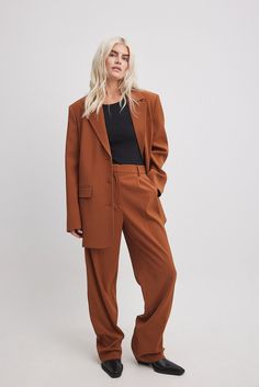 These suit pants feature a waistband with belt loops and a zipper, hook and button closure. They have a pleat detail on the front and 2 front pockets. These suit pants feature 2 mock back pockets and wide, straight legs. Inseam length in size 36: 80 cm / 31.49 in. Madewell Pant Suit, Cognac Effortless Pant, Suits Straight Pants, Women’s Suit Pants Wide Leg, Rust Long Pants, Suits For Women Straight Leg, Straight Leg Pant Suit Women, Rust Pants Women, Womens Suits Wide Leg