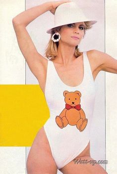 a woman in a bathing suit with a teddy bear on her chest and white hat