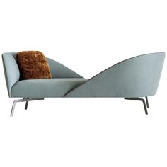 a blue chaise lounge chair with a brown pillow on it