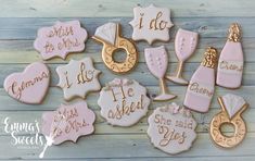 pink and gold decorated cookies with words on them