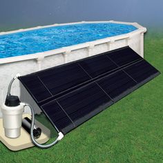 an above ground swimming pool with solar panels on the sides and a pump attached to it