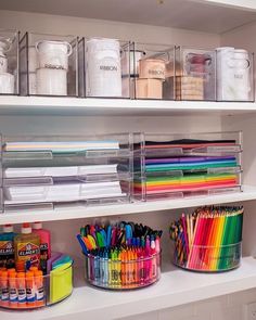 the shelves are filled with lots of different colored markers and pencils in bins