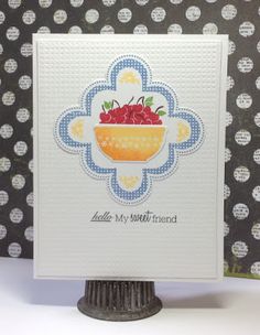 a card with a bowl of fruit on it