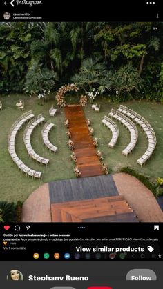 an aerial view of a wedding venue with white chairs