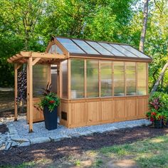 Step into your garden oasis with the Bellerose Greenhouse from Backyard Discovery. This spacious walk-in greenhouse is thoughtfully designed for gardening enthusiasts, featuring four foldable staging shelves, a built-in workstation, hose hook-ups, and six moveable plant hooks for versatile plant care and organization. Two easy-open windows provide natural airflow and allow for pollination, while the temperature-activated exhaust fan ensures optimal ventilation to create ideal growing conditions. Greenhouse Exterior, Foldable Shelves, Raised Garden Ideas, Passive Ventilation, Traditional Greenhouses, Attached Pergola, Solar Greenhouse, Greenhouses For Sale, Diy Greenhouse Plans