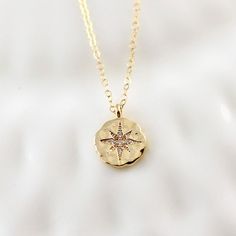 "This gorgeous gold star compass necklace will be a favorite with grads. She will love to wear this as a reminder to pursue her dreams with confidence. The necklace is made with a sparkling gold plated over brass hammered pendant with cubic zirconia accents for a little extra sparkle. The pendant measures approximately 1/2\" and hangs on a 14K gold filled cable chain in length of your choice. Necklace comes packaged on a custom gift card and boxed ready for gifting. ♥ ♥ ♥ Check out more necklace Medallion Pendant Necklace With Compass Design For Gift, Compass Design Medallion Pendant Necklace Gift, Adjustable Necklace With Star Charm, Round Pendant Medallion Necklace With Compass Design For Gift, Gift Medallion Necklace With Compass Design, Gift Compass Design Round Pendant Medallion Necklace, Medallion Necklace With Compass Design For Gift, Compass Design Medallion Necklace Gift, Spiritual Compass Design Jewelry Gift