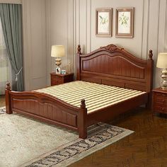 a bed room with a neatly made bed and two night stands