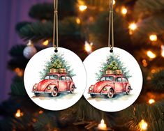 two ornaments hanging from a christmas tree decorated with red vw bug and presents on top