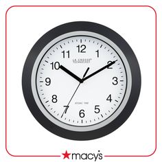 a black and white clock with the words macy's on it in red frame