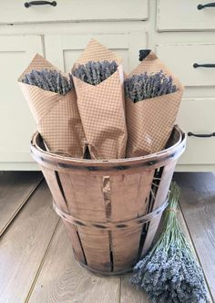 lavender flowers in a basket on the floor