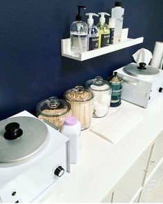 a bathroom counter with various items on it