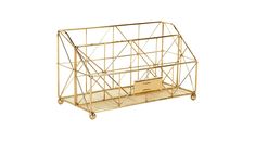 a golden metal cage with a box on it