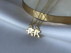 "This tiny puzzle piece pendant is personalized with your lowercase letter choice and paired with a beautiful chain. Get a bunch as perfect gifts for a friend group or family! Available in your choice of silver, gold, or our new rose gold options. Easily mix and match metal colors for large orders by specifying the letter and necklace color in the Note to Seller section at checkout. The necklace is adjustable from 16\" - 18\" inches. ⋯ P E R F E C T F O R ⋯ ♡ Valentine's Day Gift ♡ Galentine's D Long Distance Jewelry, Bff Christmas Gifts, Gifts For A Friend, Puzzle Piece Necklace, Long Distance Relationship Gifts, Lowercase Letter, Bff Gift, Necklace Mom, Friend Jewelry