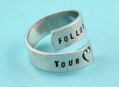 "Wonderful twist aluminum ring handstamped with the words \"Follow Your Heart\" with the heart being the design stamp of a heart in our tiny uppercase font! Great Valentine's Day gift! Even though this is an adjustable ring, please choose your size at checkout so we can make it fit better. If you would like to order more than one, put one in your cart and choose the size, then add another into your cart and choose the size again. We do offer other fonts for this ring - please see last picture. A Sticky Note Heart Ring, Aluminum Jewelry, Design Stamps, Twist Ring, Follow Your Heart, Jewelry Card, White Jewelry, Follow You, Custom Bracelets