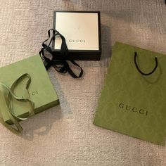 Gucci Storage Bundle Includes The Following: Gucci Storage Box (Green) | 7.5” X 7.5” X 3” Magnetic Closure And Comes W/ Matching Ribbon Gucci Storage Box (Blk/White) | 7.5” X 7.5” X 3” Lift Lid And Comes W/ Black Ribbon *Has Black Smudge On Top Caused By Color- Bleed From Ribbon (See Last Photo) Gucci Shopping Bag (Green) W/ Black Handles | 13.75”H X 10.25”W All Items From A Smoke-Free And Pet-Free Home. All Brand New With No Visible Dings Or Rips In Paper. Except For The Smudge On The Black/Whi Gucci Shopping Bag, Black Handles, Bag Green, Black Handle, Box Bag, Black Ribbon, All Brands, Green Bag, Bago