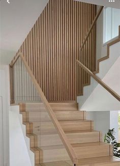 the stairs are made of wood and have handrails