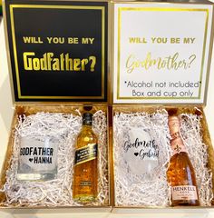 two bottles of booze in a box with greeting cards and a card that says will you be my godfather?