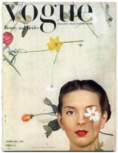 a magazine cover with a woman's face and flowers on her forehead, in front of a white background