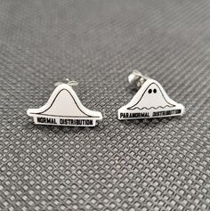 These earrings are made by women in STEM! Cute and fun math stud earrings! These earrings were made by printing a normal and paranormal distribution onto shrinky dink plastic, then baking and finishing with resin. Funny Paranormal, Math Earrings, Stem Earrings, Math Puns, Bell Curve, Normal Distribution, Women In Stem, Math Gift, Halloween Math