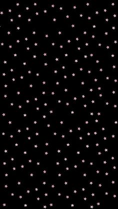 small pink stars on a black background