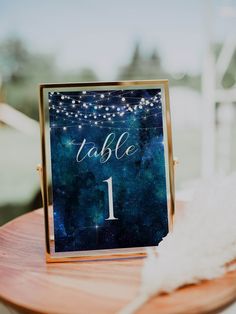 a table number sitting on top of a wooden table