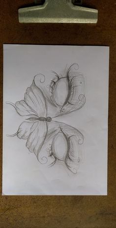 a pencil drawing of two flowers on a piece of paper