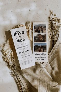 a save the date card and some dried plants on a table with an old photo