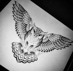 a black and white drawing of a bird with wings on it's back side