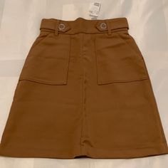 Brand New Brown High Waisted Midi Skirt From H&M. The Fabric Is Thick And Not Very Stretchy. 67% Polyester 33% Viscose. Super Cute And Closet Staple! High Waist Brown Skort With Pockets, Brown Mini Length Bottoms For Workwear, Brown Mini Skirt With Pockets, Brown Mini Skirt For Summer Workwear, Brown Summer Mini Skirt For Workwear, Summer Brown Mini Skirt For Work, Brown Pencil Skirt With Pockets, Brown Short Length Skirt For Workwear, H&m Relaxed Midi Skirt