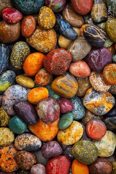 many different colored rocks are arranged together